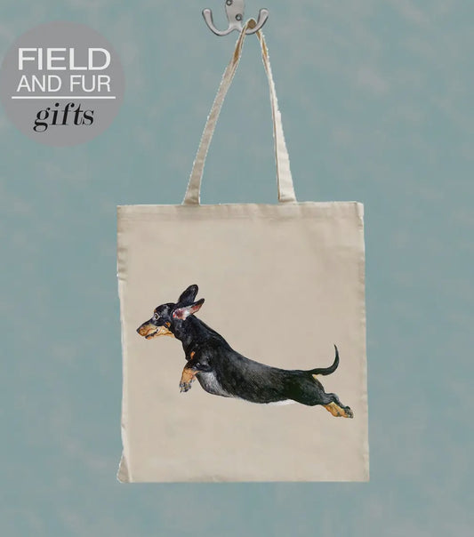 Jumping black and tan Dachshund tote bag